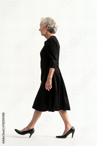 Elegant Senior Woman in Black Dress Walking Positively - Confidence Banner