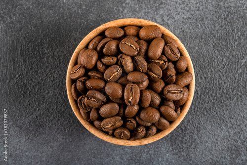 A bowl full of roasted coffee beans,top view