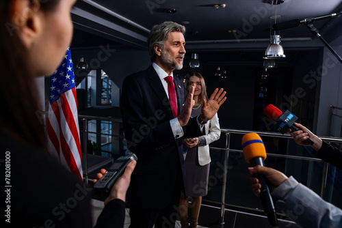 Serious United States Presidential Candidate answers journalists questions, gives interview for media and TV news in government building. American politician during press conference. Political speech.