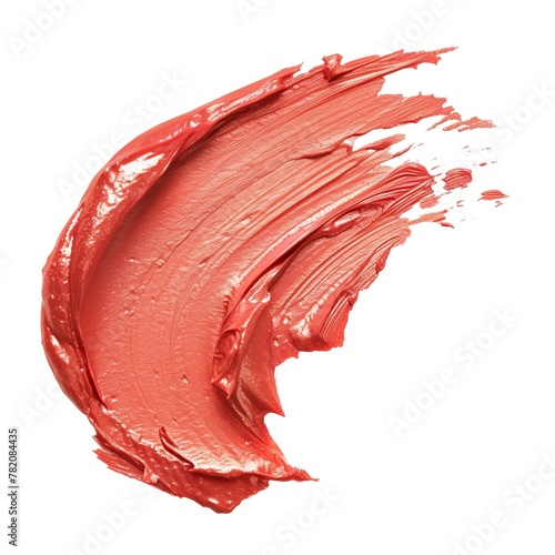 A smear of red orange lipstick on a white background