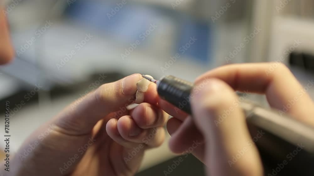 Dental technician working in dental laboratory. Dental spesialist making denture prothese. Dentist Making facial dental prosthesis for patients with oral problems Dental technician working in dental laboratory. Dental spesialist making denture prothese. Dentist Making facial dental prosthesis for patients with oral problems