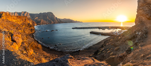 Panoramic of the cliffs and coast of Agaete at summer sunset in Gran Canaria. Spain photo