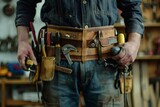 A portrait of a construction worker wearing a tool belt