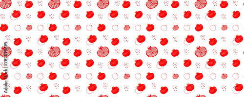 Seamless pattern. Juicy pomegranate on an isolated background. Modern summer pattern