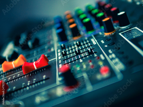 Close-up of sound recording equipment knobs.Mixer control. Music engineer. Backstage controls on an audio mixer, Sound mixer. Professional audio mixing console, buttons, faders and sliders.  photo