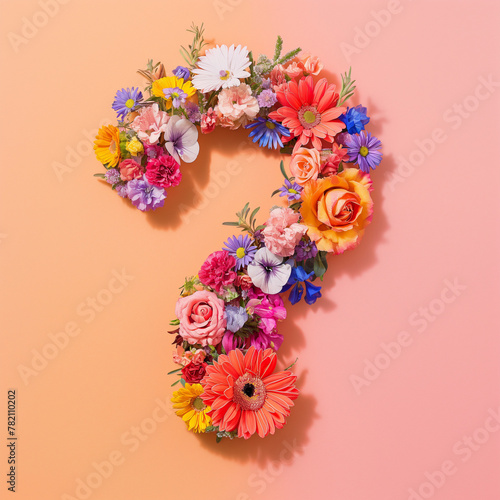 Colorful question mark made of flowers isolated on pastel pink and orange background. Creative spring concept © Femmes.Digital