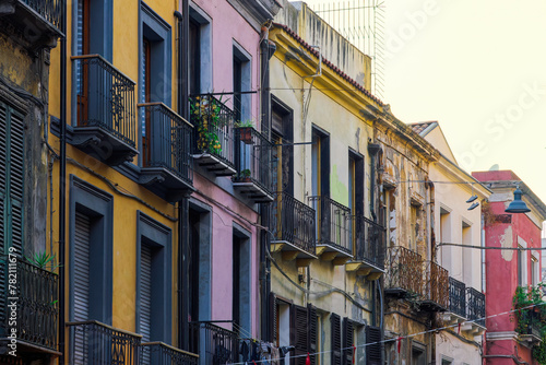 Cagliari historic center colorful buildings facade with wooden window shutters and iron balconies in Sardinia Island  Italy.