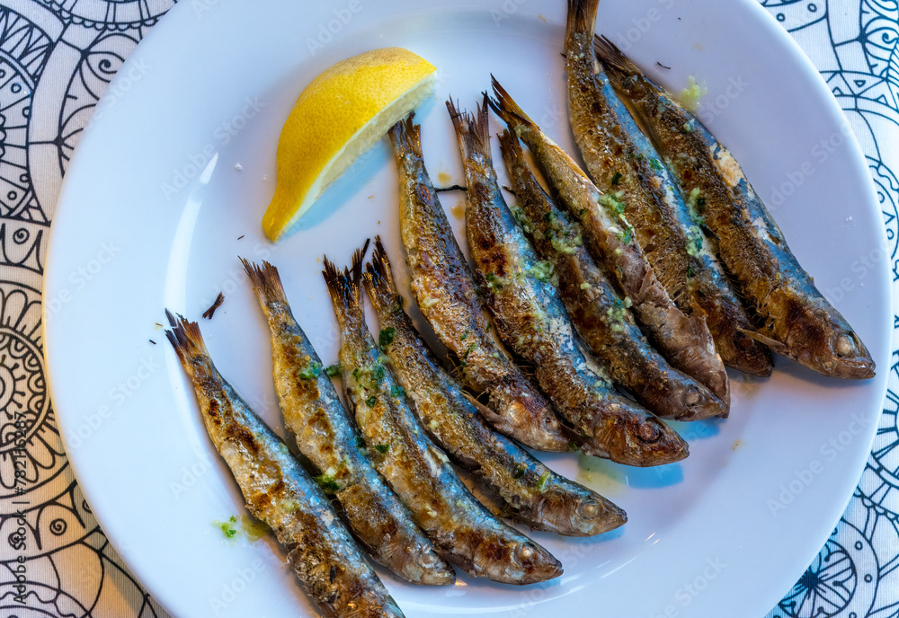 Amazingly fresh grilled sardines served with garlic and herb butter and a wedge of lemon. Omega3. Healthy. Amazingly fresh grilled sardines served with garlic and herb butter and a wedge of lemon. Omega3. Healthy.