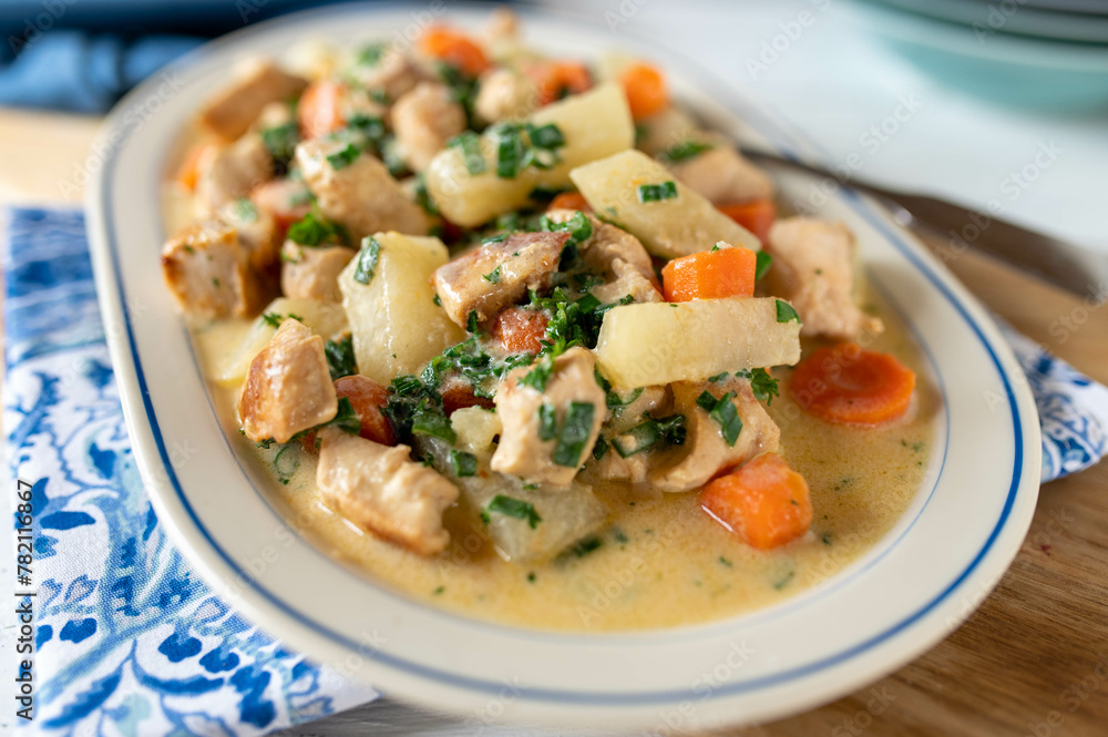 Chicken breast with carrots and kohlrabi vegetable in a light bechamel sauce