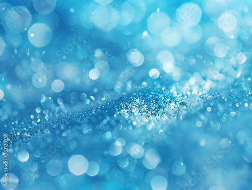 Abstract light blue background with glitter lights and shimmering particles. Circle blurred bokeh. Festive backdrop.