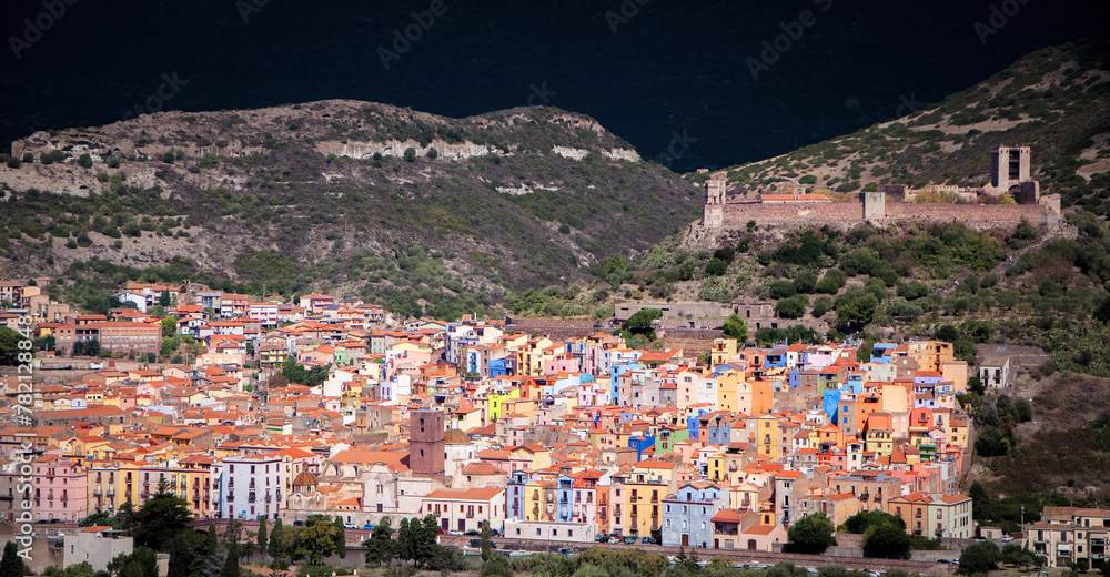 Scenic view of Bosa nestled among majestic mountains. Sardinia, Italy