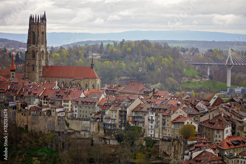 Panoramic view of Fribourg, a charming city blending old-world architecture and modern living, nestled along the serene Sarine River in Switzerland. photo