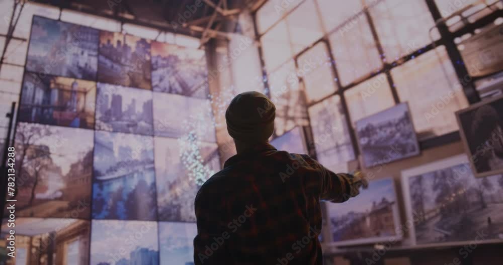 A Man Standing In Front Of A Wall Of Pictures With A Chandelier Warehouse District Photorealism Museums A Man Standing In Front Of A Wall Of Pictures With A Chandelier Warehouse District Photorealism Museums