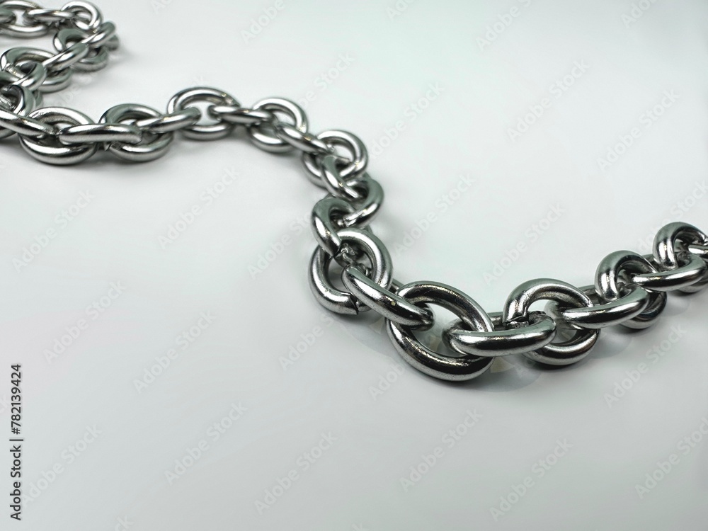 Fototapeta premium Closeup metal chain on white background.