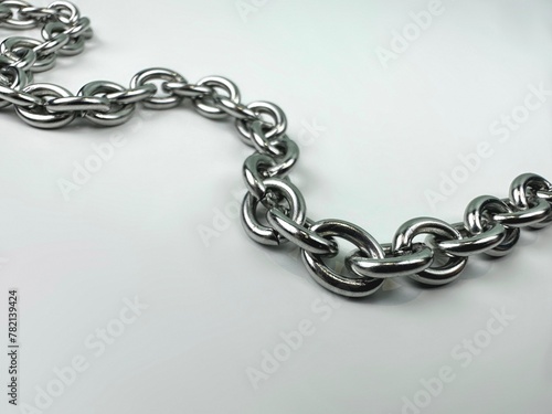 Closeup metal chain on white background.