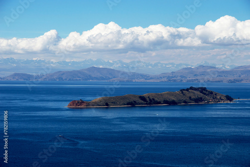 Moon Island on Lake Titicaca in Bolivia under a sky with clouds