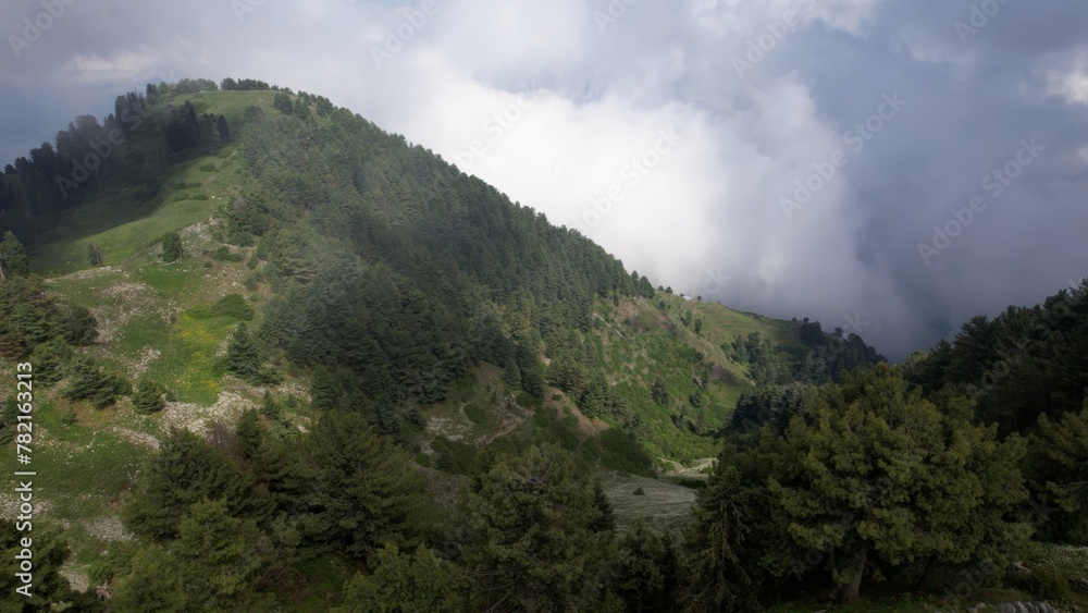 Misty mountain landscape with lush greenery, Pir Chinasi Kashmir, Pakistan