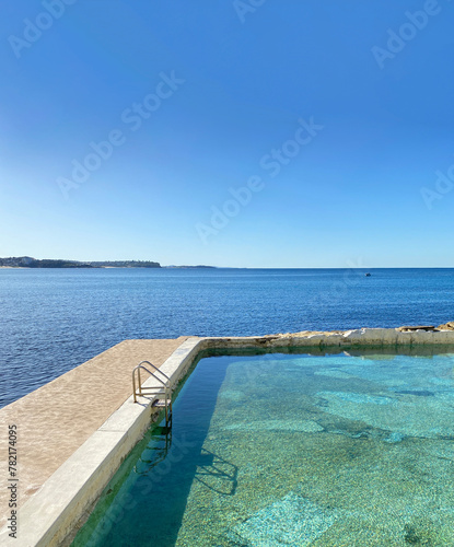 Public swimming pool near the ocean. Tidal pool. Rock Pool. Landscape, shore and view of the coast. © Stephanie