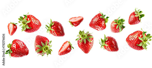 Strawberries. Falling strawberry fruits whole and cut isolated on white background