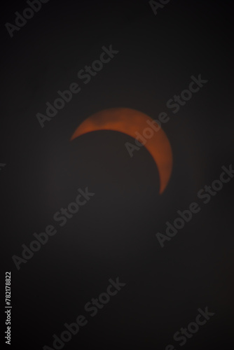 This is the solar eclipse seen from Pennsylvania on April 8th, 2024. This is only partial and not full. The beautiful fireball is being covered by the moon. The oranges and yellows are so bright.