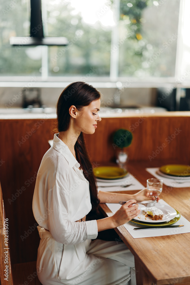 Romantic Dinner at Home Smiling Woman Enjoying a Delicious Meal with Cake and Wine