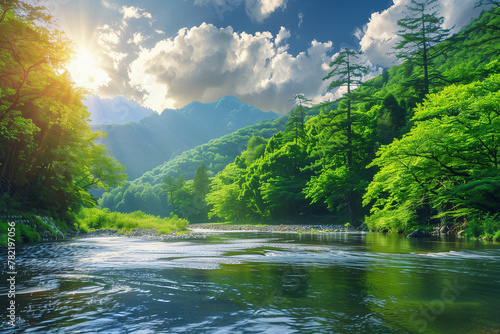 Lush greenery and towering trees flank a serene river, with sunbeams piercing through clouds above mountains.