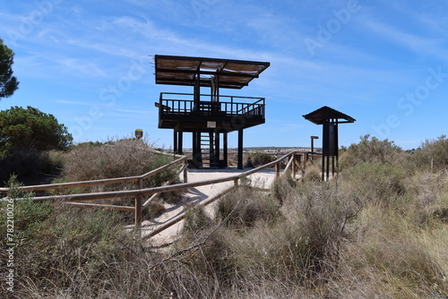 Salinas El Pinet, La Marina, Alicante, Spain, April 10, 2024: Bird observatory tower on the dune route of Salinas del Pinet, La Marina, Alicante, Spain
