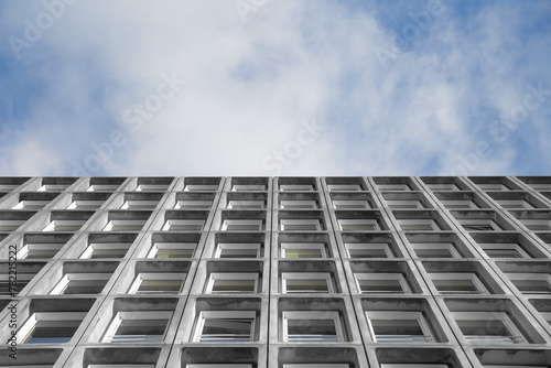 elevation angle of modern building facade with sky, business concept