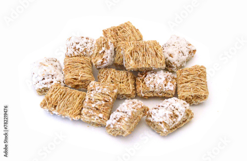 Breakfast setting with frosted wheat cereal on white background