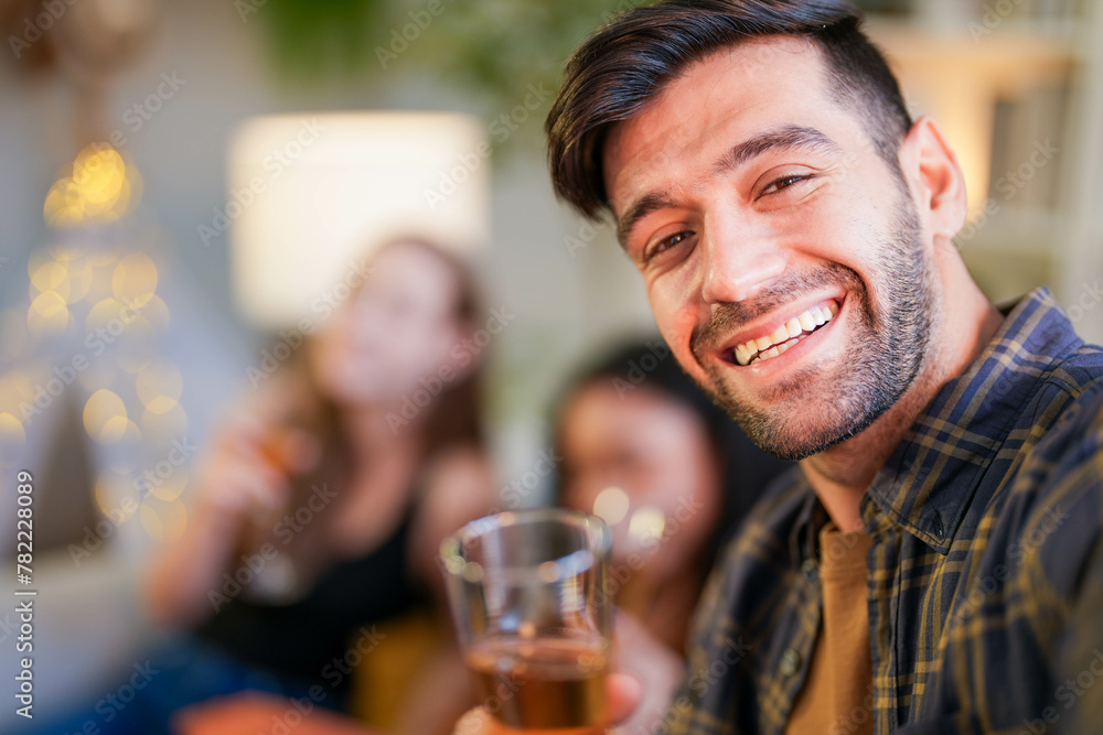Friends captured mid-laughter as they toast in a stylish home, taking a selfie to remember the cheerful occasion Friends captured mid-laughter as they toast in a stylish home, taking a selfie to remember the cheerful occasion