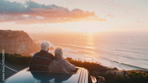 Elderly couple watching sun...