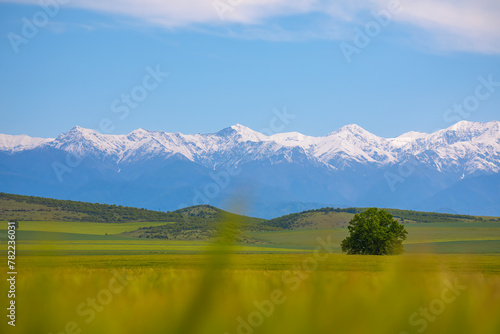 Beautiful mountain landscape, green fields in Ismayilli region of Azerbaijan. View of the Caucasus mountain peaks photo