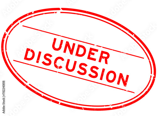 Grunge red under discussion word oval rubber seal stamp on white background