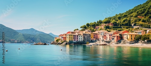 Houses cluster along sandy beach shore