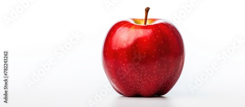 Red apple with leaf and isolated Adam's apple on white background photo