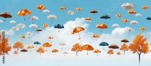 Autumn umbrellas flying amidst trees