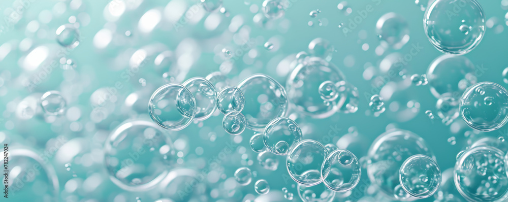 Close-up of bubbles on aqua colored background