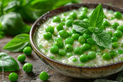 A close-up of pea risotto topped with mint, showcasing the texture and vibrant green color of this Italian classic. photo