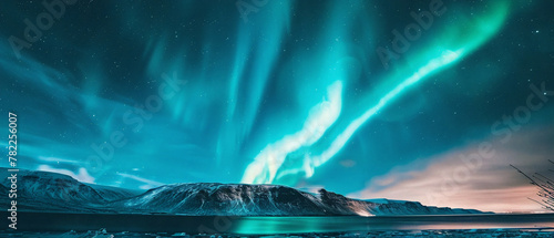 The night sky ablaze with vibrant colors as the northern lights swirl and dance above. © Szalai