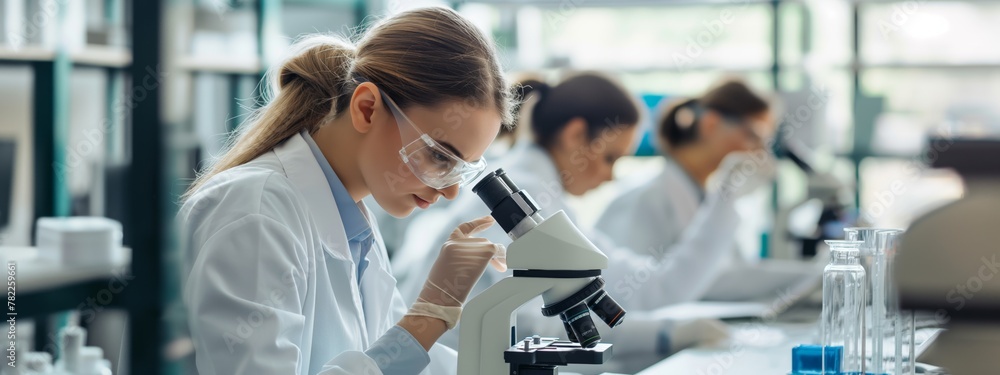 Young female scientists or students conduct scientific research in a medical laboratory Young female scientists or students conduct scientific research in a medical laboratory