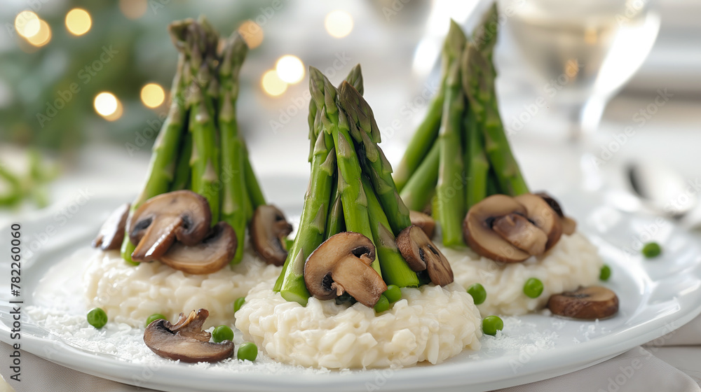 A plated dish featuring risotto topped with a bundle of asparagus and sliced mushrooms, garnished with peas. A plated dish featuring risotto topped with a bundle of asparagus and sliced mushrooms, garnished with peas.