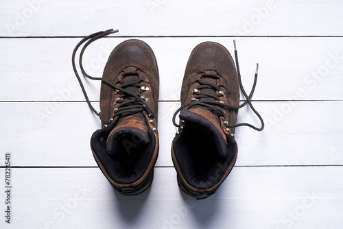 Brown Hiking Boots on White Wooden Floor
