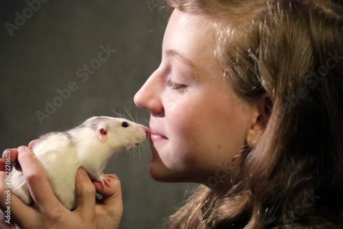 Young girl with pet, cute rat, smiling, kiss, portrait, close up.