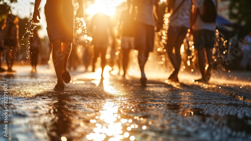 City dwellers walking through water on the street at sunset, splashes around. Urban summer heatwave concept. Design for weather news article, city life