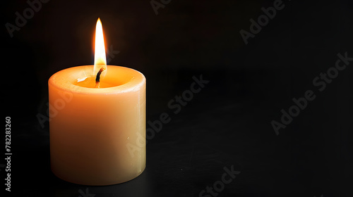 Single white burning candle on black background. Funeral, mourning, memorial service concept