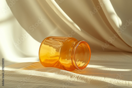 Amber Glass Jar on Textured White Linen in Soft Light