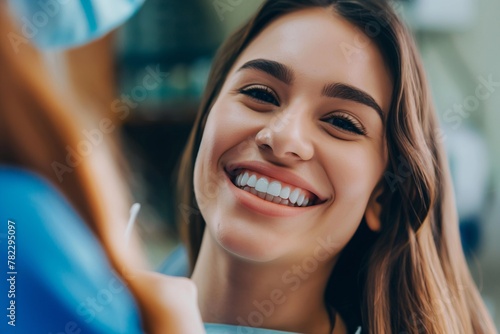 smiling young woman receiving dental checkup. close-up view. Healthcare and medicine concept. 