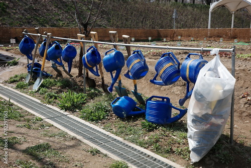 watering cans hanging 
