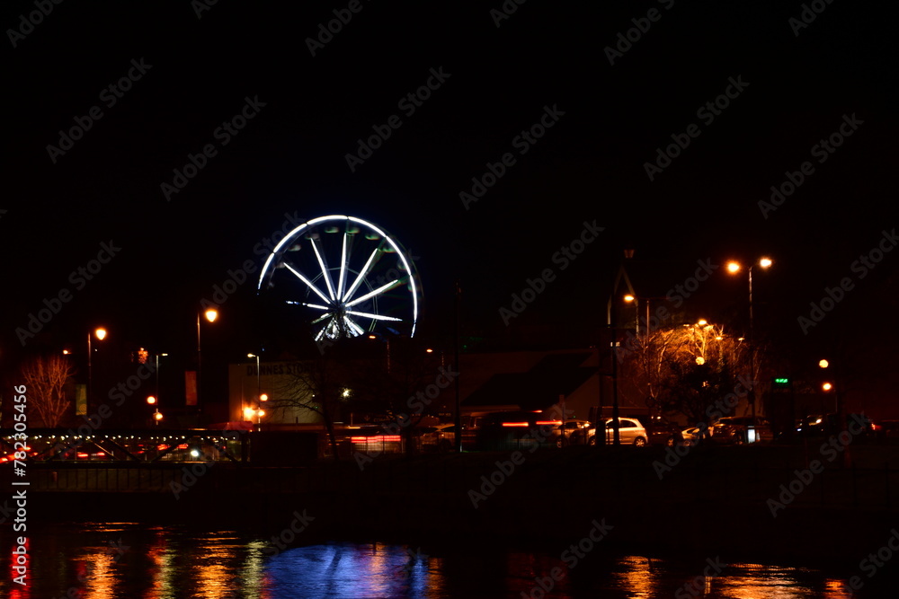 Ferris wheel at night on St. Patrick's Day. Kilkenny, Ireland