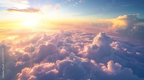 Amazing view above the clouds at sunset. The soft colors of the sky and clouds create a peaceful and serene scene. photo